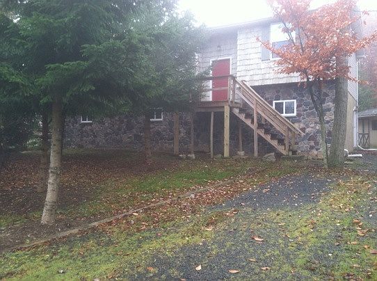 Front of house (trees removed/new stone in driveway)