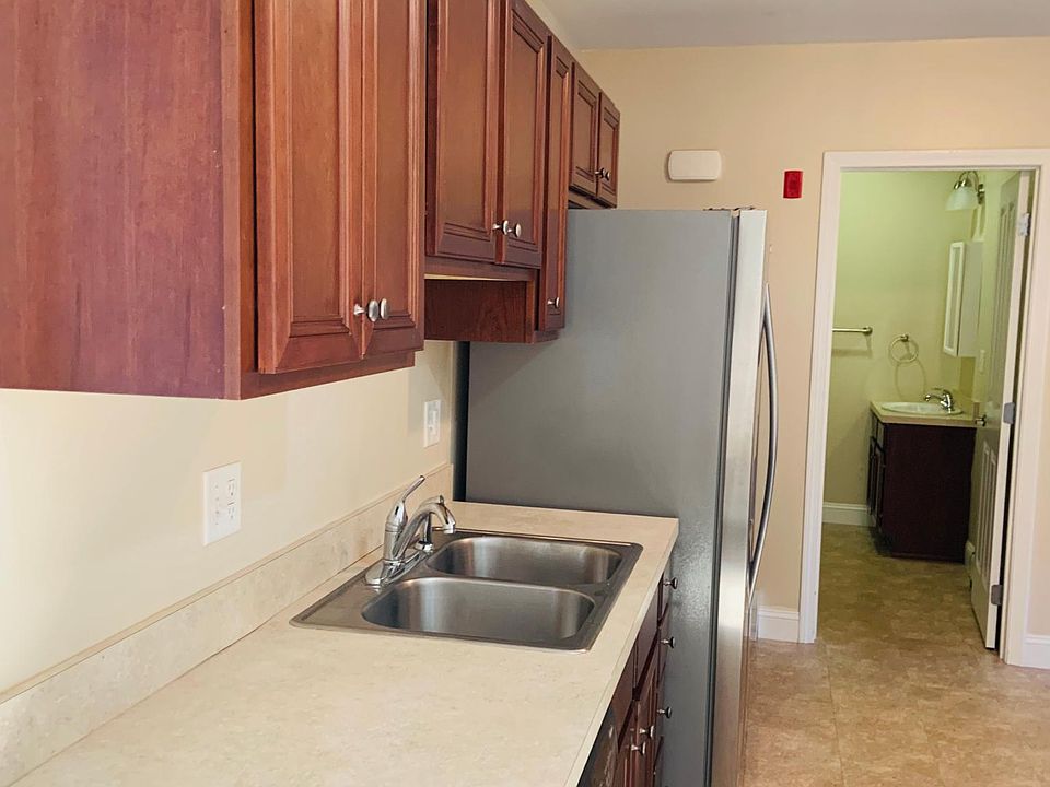 Kitchen sink, fridge and bathroom