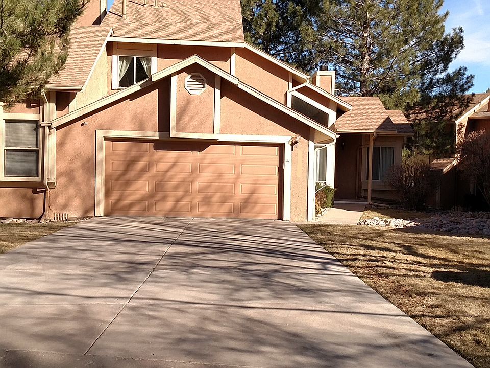 Two car garage. Driveway. End Unit.