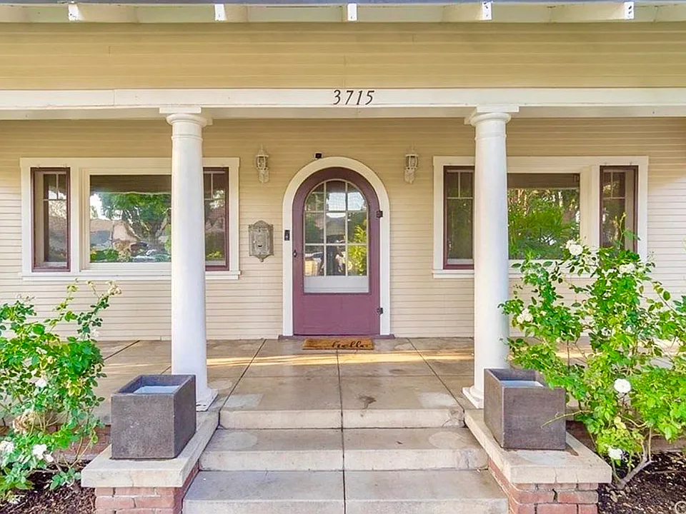 Classic period front door with screen and ample porch space for couches, chairs, swing, etc...