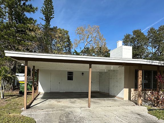 Car port with laundry room access