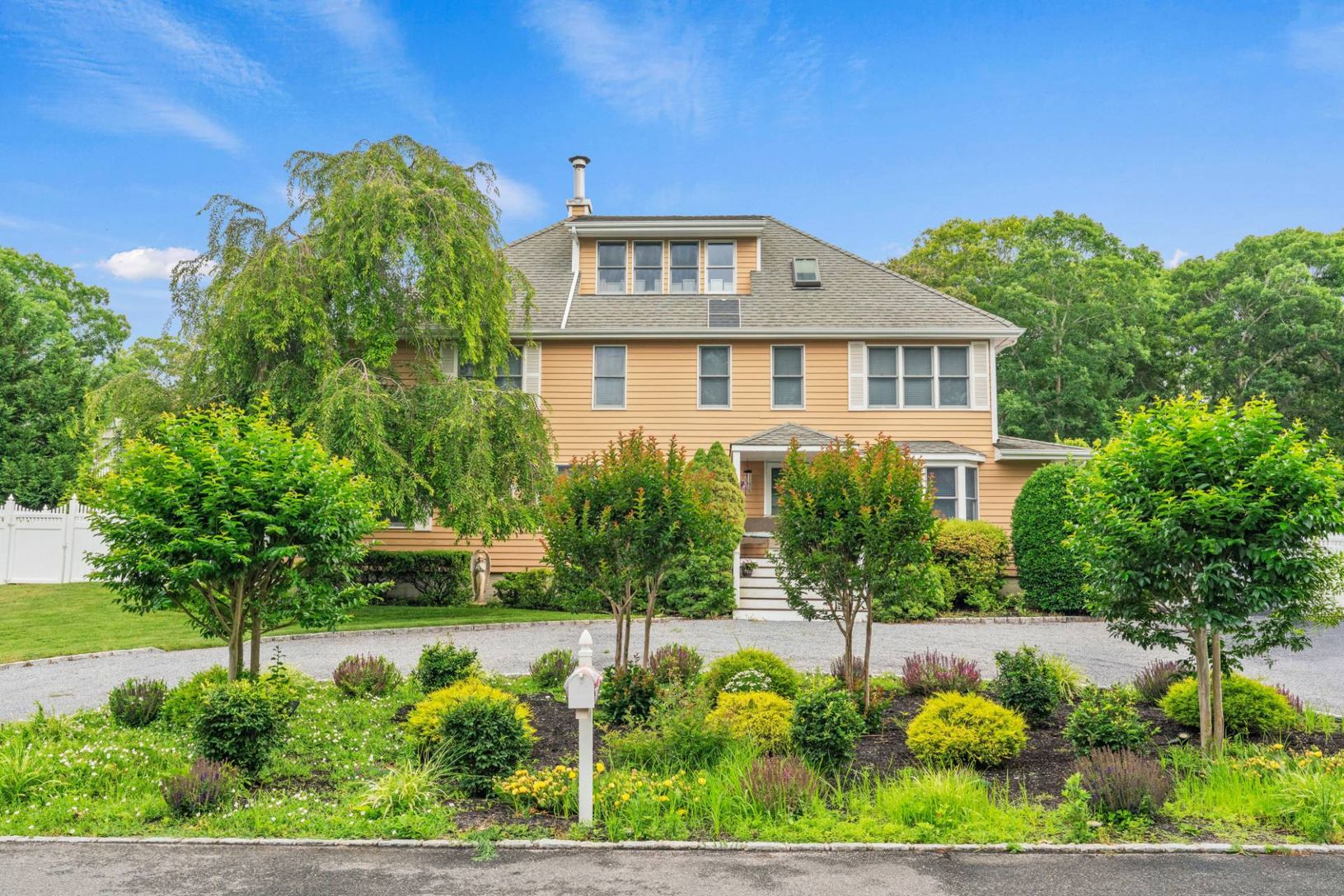 Front View of this 3 level residence with circular drive.