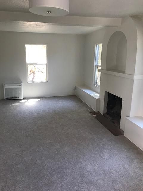 Large Air Conditioned Living room with wood burning fireplace.