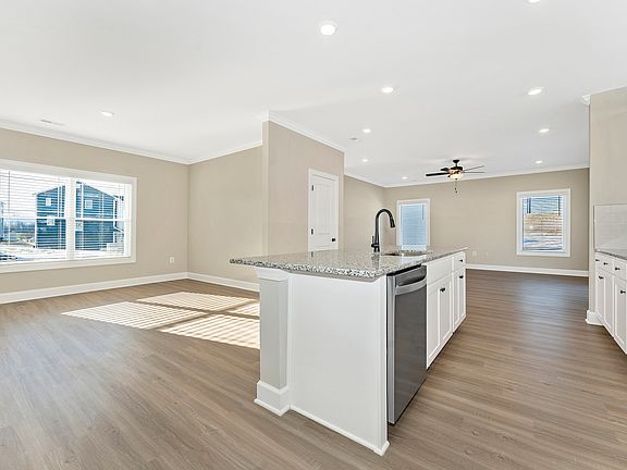 The kitchen has wood cabinetry