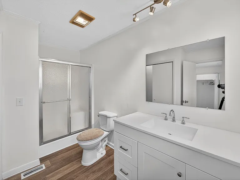 The primary bathroom also has an extra closet.