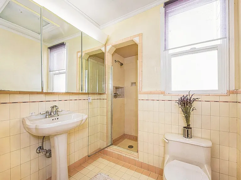 2nd Bathroom on 2nd floor with original period details and tiling.