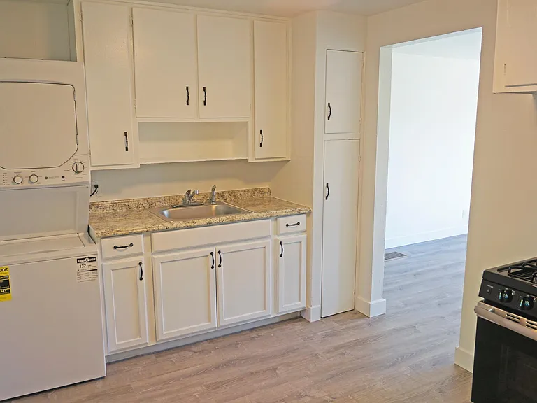 freshly painted cabinets and newer appliances