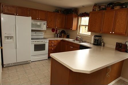 kitchen with lots of counter space and window to back yard