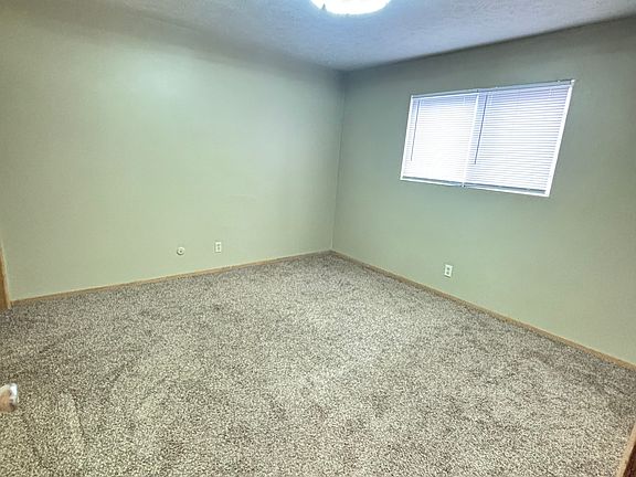 "Spacious bedrooms with windows that fill the rooms with natural light, creating a warm and inviting atmosphere."