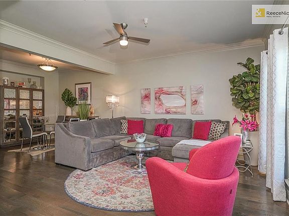 As you enter this home, you find the large living room with dining room in the background.