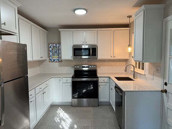 Kitchen new cabinets, countertops, floors, and appliances