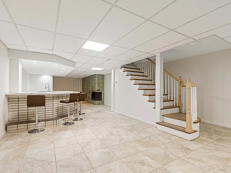 finished basement with stairs up to main floor