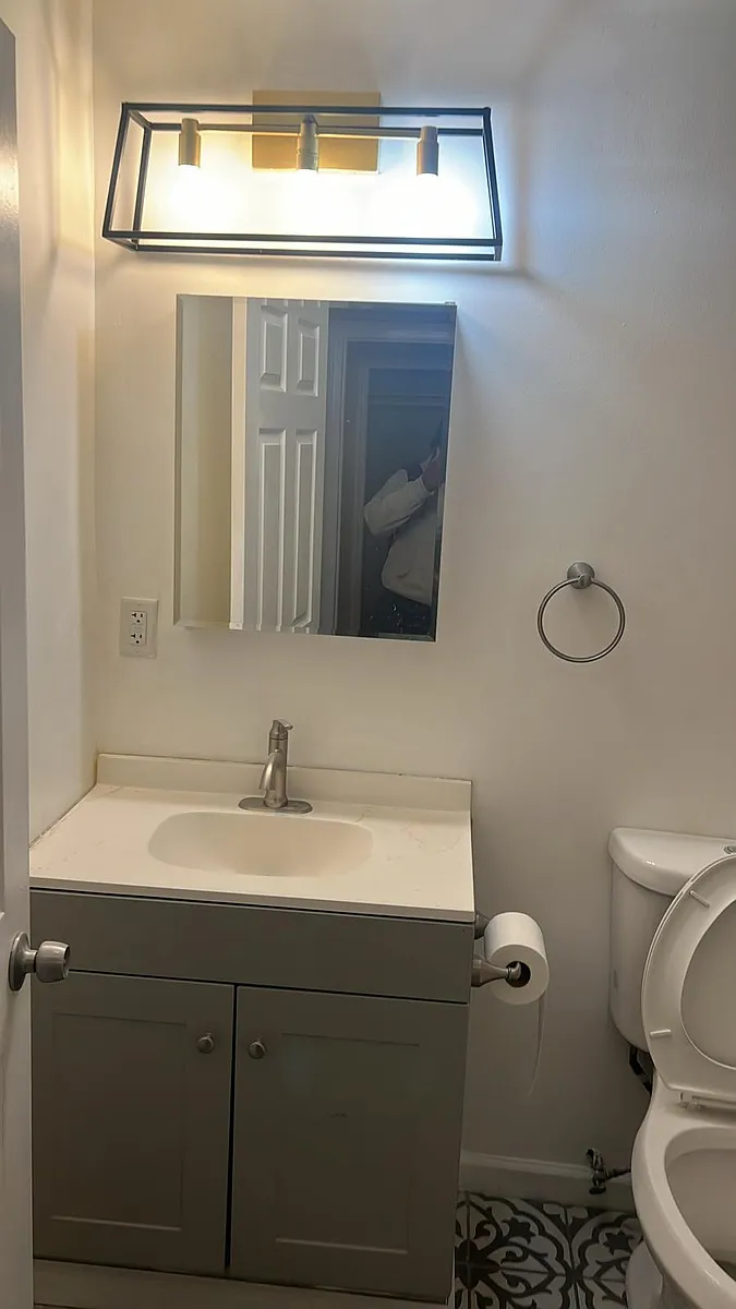 Updated bright bathroom with new fixtures. - Clinton Ave