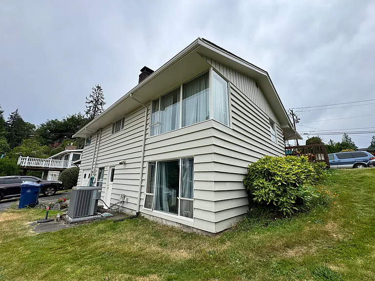 View of the back of house with side yard