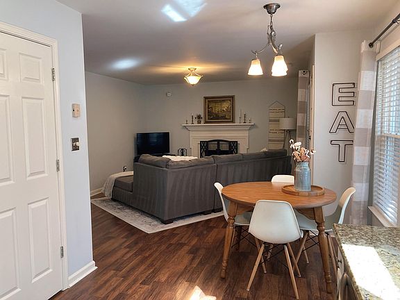 view from kitchen to family room with fire place