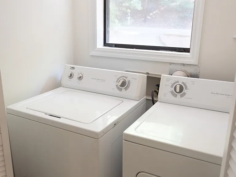 In the middle of the second floor, we pass the laundry room in the hall.