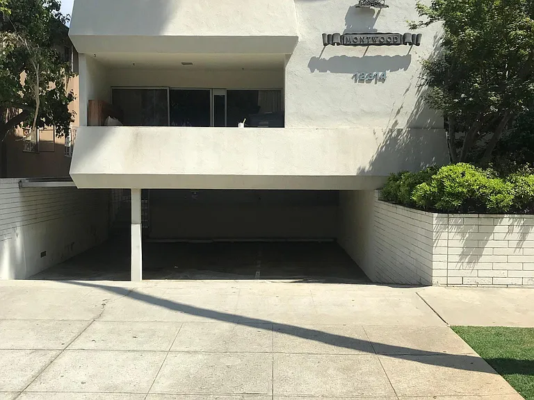 Front of building across from Brentwood Country Club golf course.