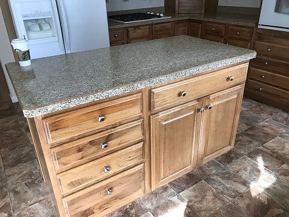 Kitchen island. Kitchen has a lot of storage and counter top space.