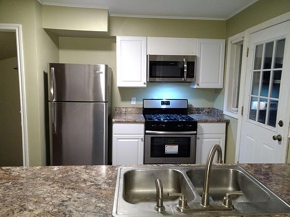 Stainless appliance set, Grohe faucet, newer cabinets, counter tops and flooring.