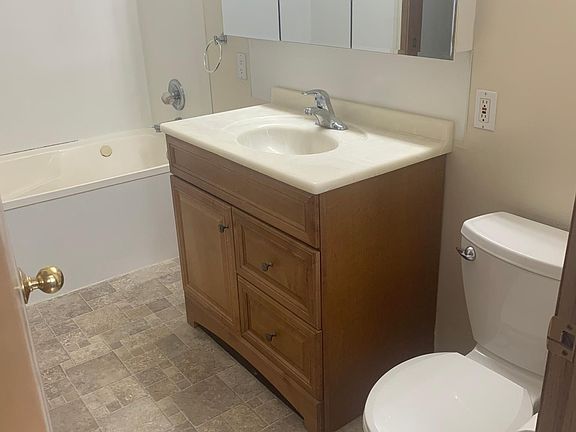 Large bathroom with Jacuzzi bath tub with shower