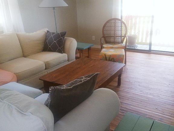 Spacious, light filled living space, furniture for comfort. Access to balcony off living room.