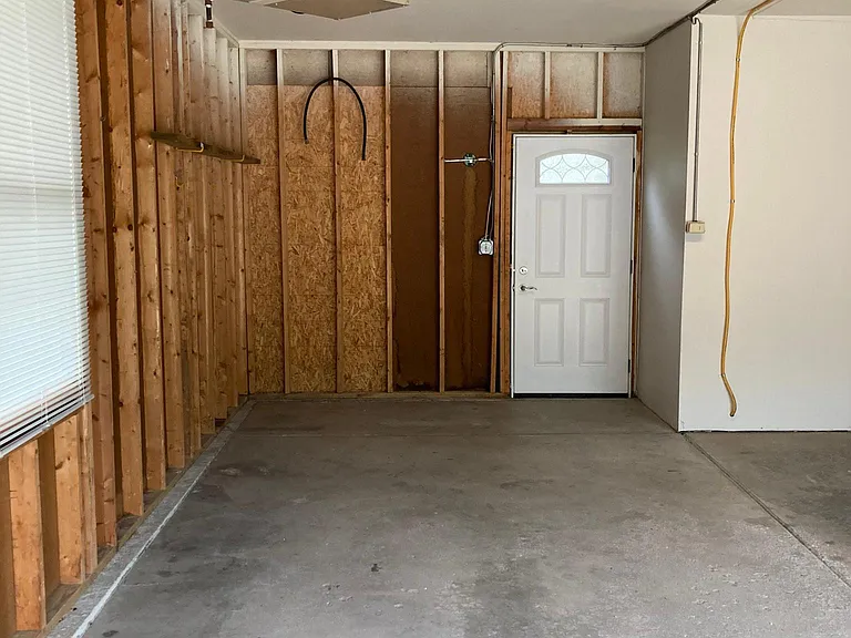 Spacious 2 car garage with extra storage area
