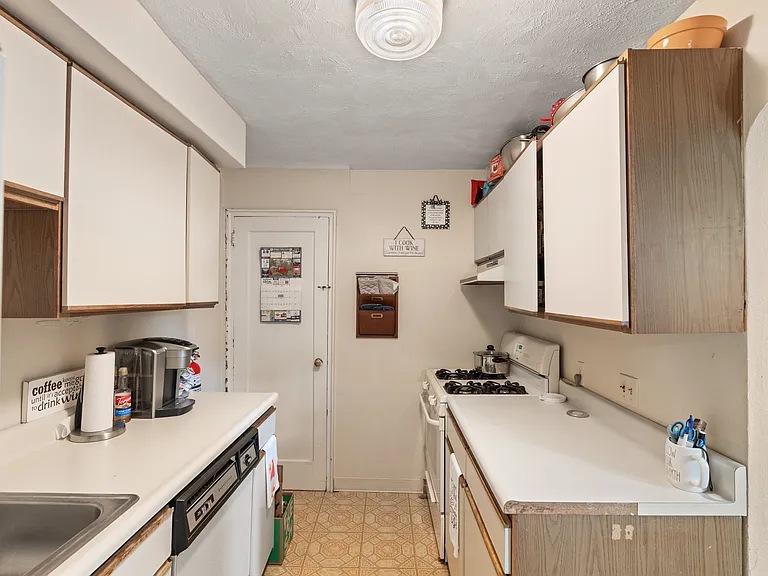 Door leads to basement - storage & laundry hook-ups