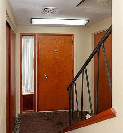 Upon entry there is a huge coat closet and spacious unfinished room and laundry area.