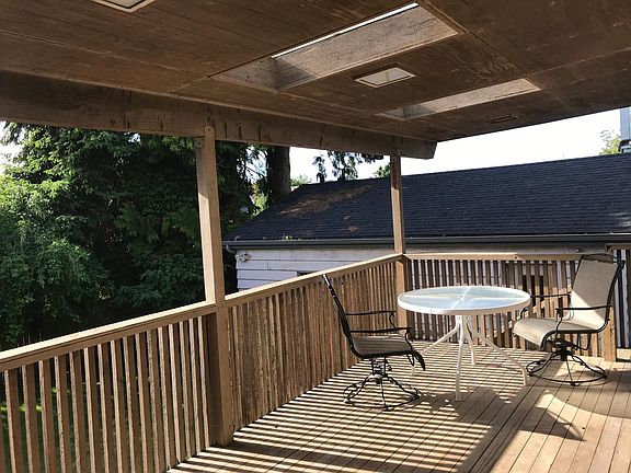 Large deck off kitchen faces Greenlake.