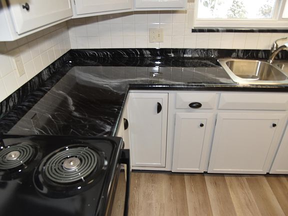 Epoxy countertop and new door and drawer pulls.