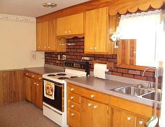 The kitchen includes an electric ovenrange and refrigerator. The washer and dryer are staying too. N