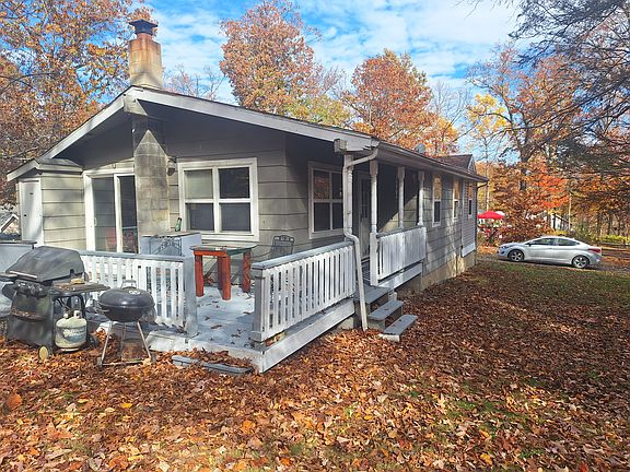 Large side deck w/slider door to great room. One step up to deck and you are at house floor level