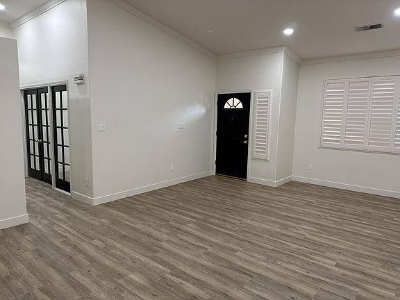 Entrance and living room. Office through the glass French doors in hall.