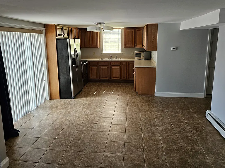 Kitchen and dining area. Bathroom & bedroom are to the right of the kitchen
