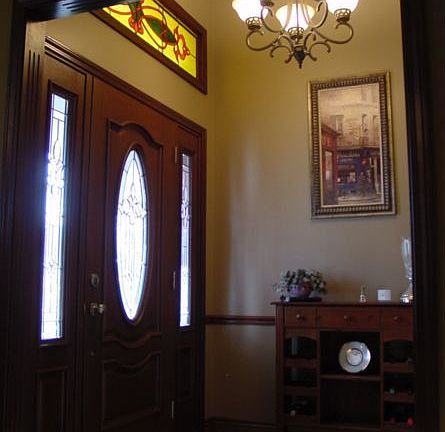 Entry with beautiful front door, side lights and stain glass transom.