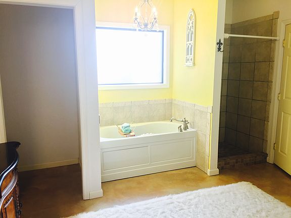 Jacuzzi tub and tile shower 