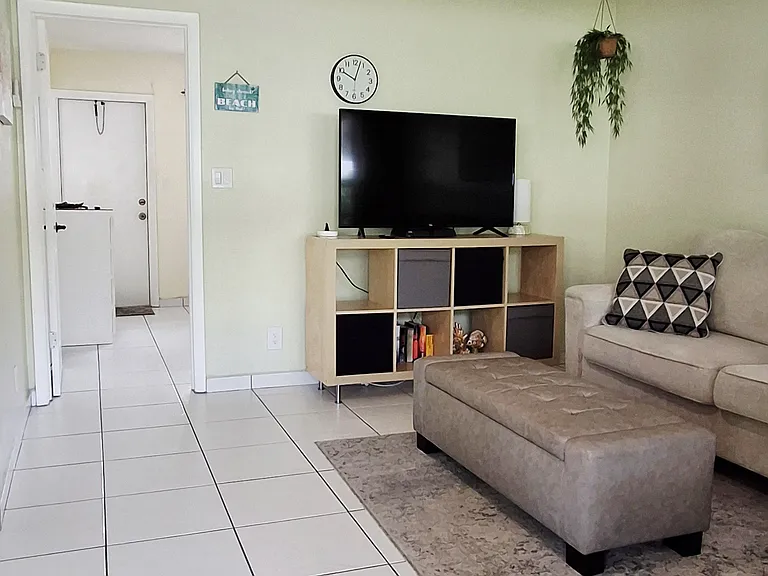 living room area / door to bedroom