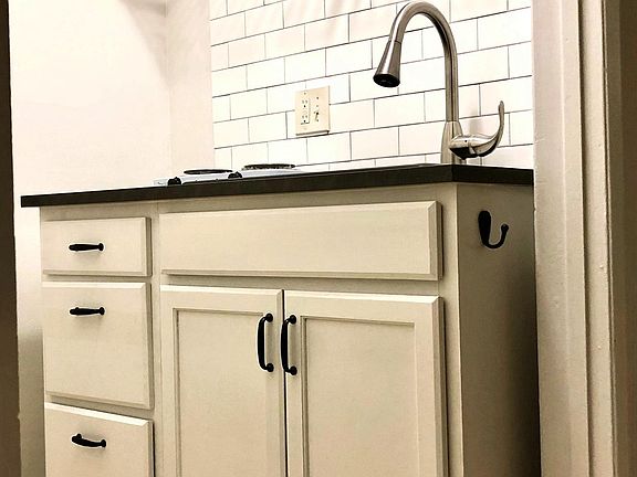 Kitchenette w/ Solid Wood Cabinets; Ceramic Subway Tile Backsplash; Stainless Steel Shelves