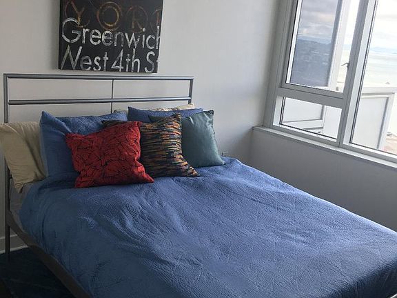 Full Size bed in room with Tuft and Needle Mattress included