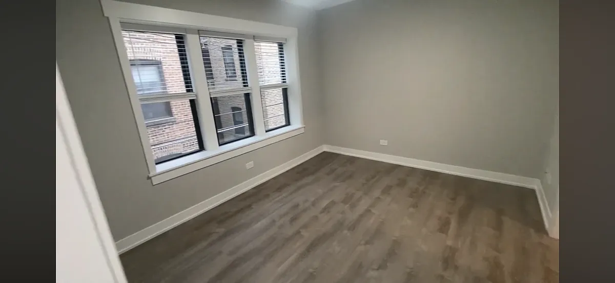 Building Photo - 6521 N Newgard Ave #3E