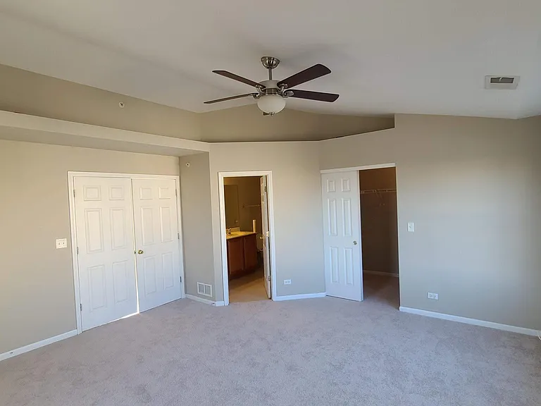 Master bedroom with walk in closet, double sink in master bath and multiple windows