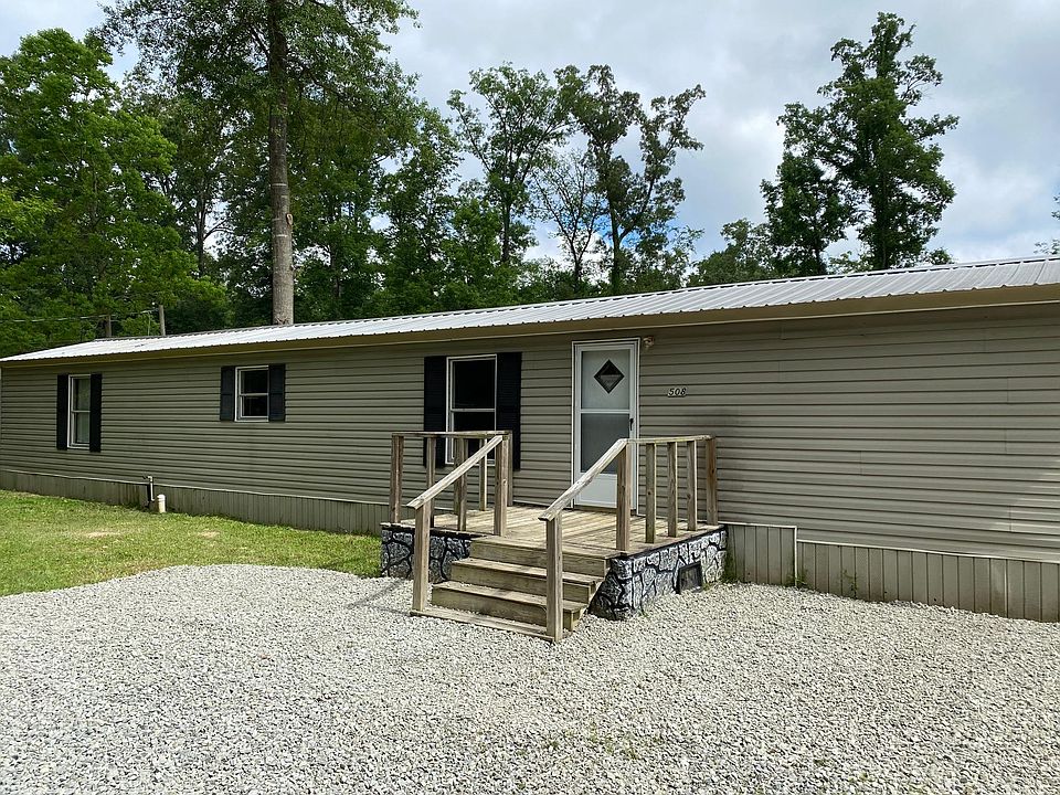 Front entrance of mobile home with deck