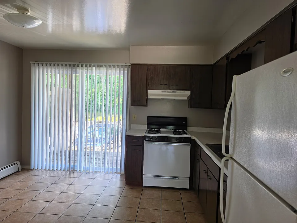 Kitchen and patio door to private balcony