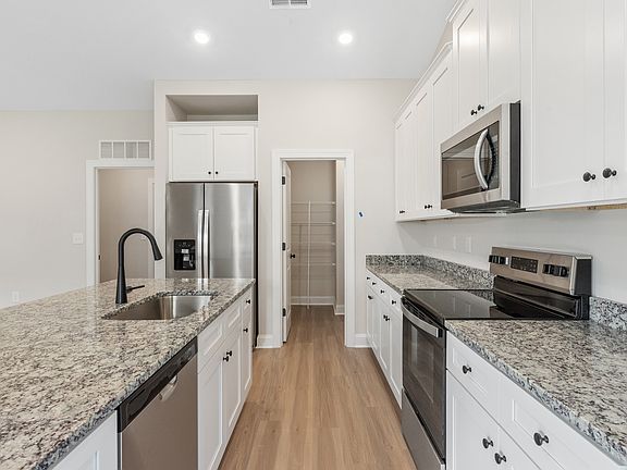 This kitchen has ample countertop space and included stainless steel appliances