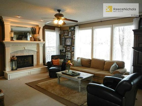 Fabulous family room with fireplace and wall of floor to ceiling