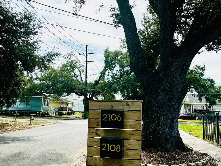 Curbside, sidewalk view with mailboxes