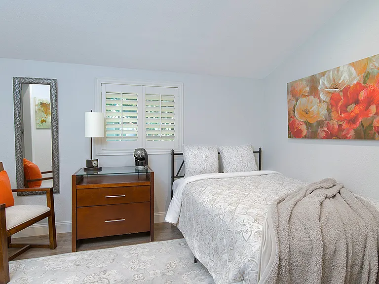 Second bedroom with full size bed and desk.