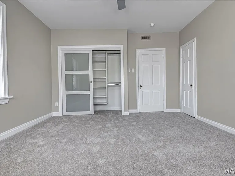 Lighted custom closets in both bedrooms.