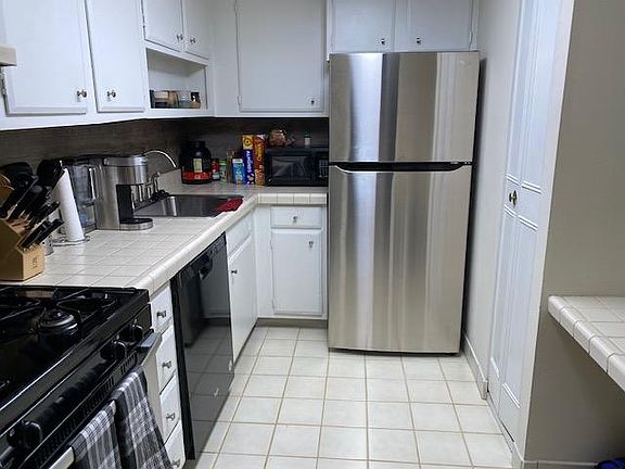 Kitchen with newer refrigerator