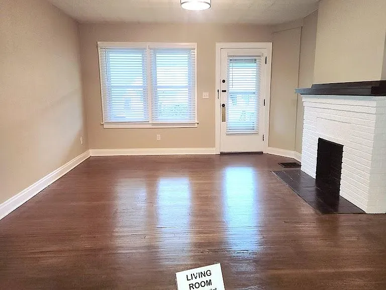 Living Room & front door entrance, 14'6" x 13'2", newly refinished hardwood floor, decorative fireplace, two windows, new locks, new wide cordless blinds, new ceiling light fixture, extra outlet installed